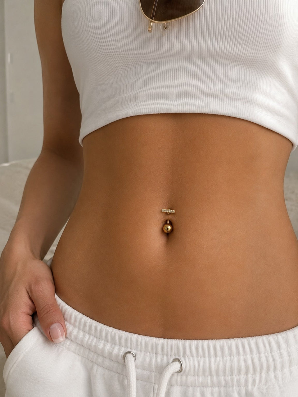 18K gold-plated navel rings featuring sparkling cubic zirconia designs.