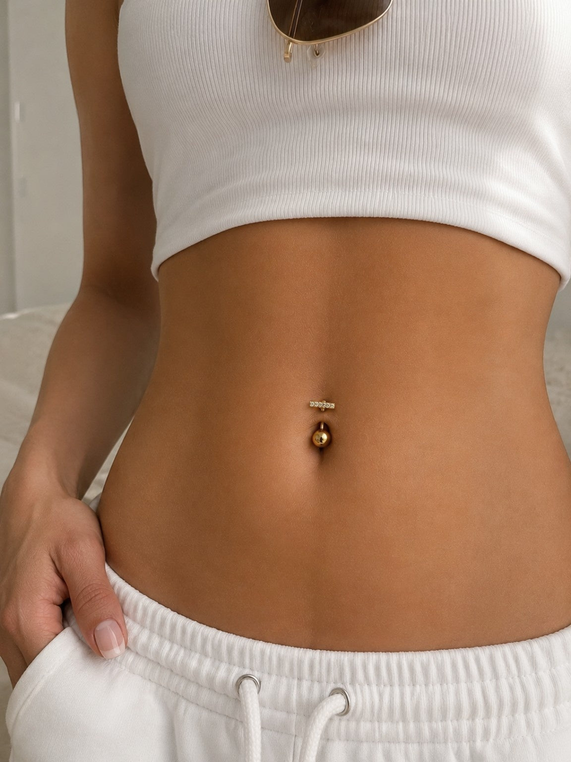 18K gold-plated navel rings featuring sparkling cubic zirconia designs.
