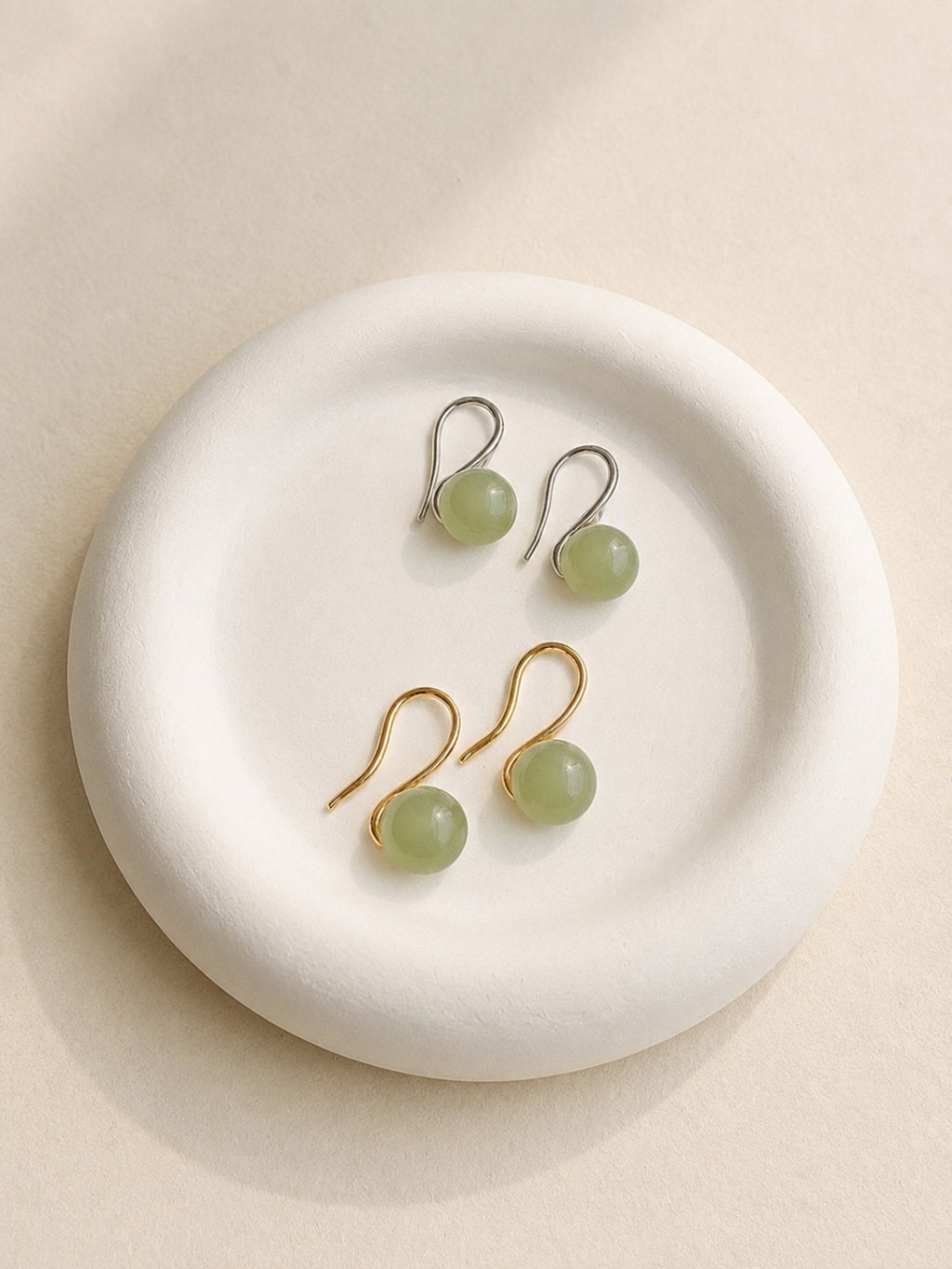 Jade drop earrings with natural green gemstones and 14K gold plating.