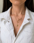 Heart stethoscope necklace in gold and silver stainless steel.