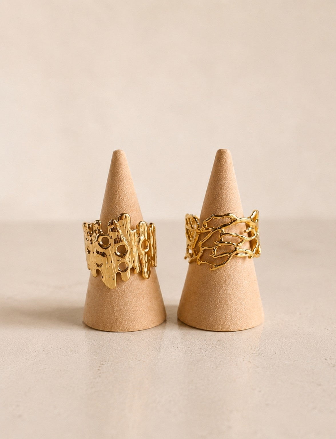 Molten chunky ring with a 14K gold-plated non-tarnish adjustable band.