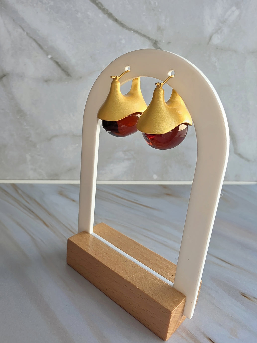 Natural look amber drop earrings in gold plated setting