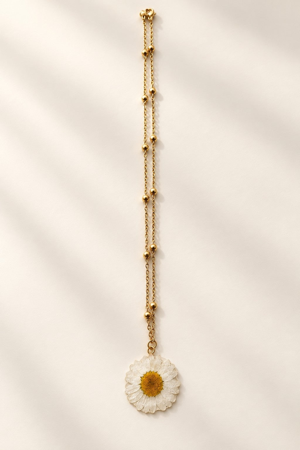 Botanical real flower necklace with clear resin pendant