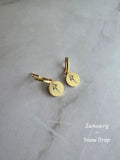 Elegant birth flower huggie earrings with engraved floral charms for women.