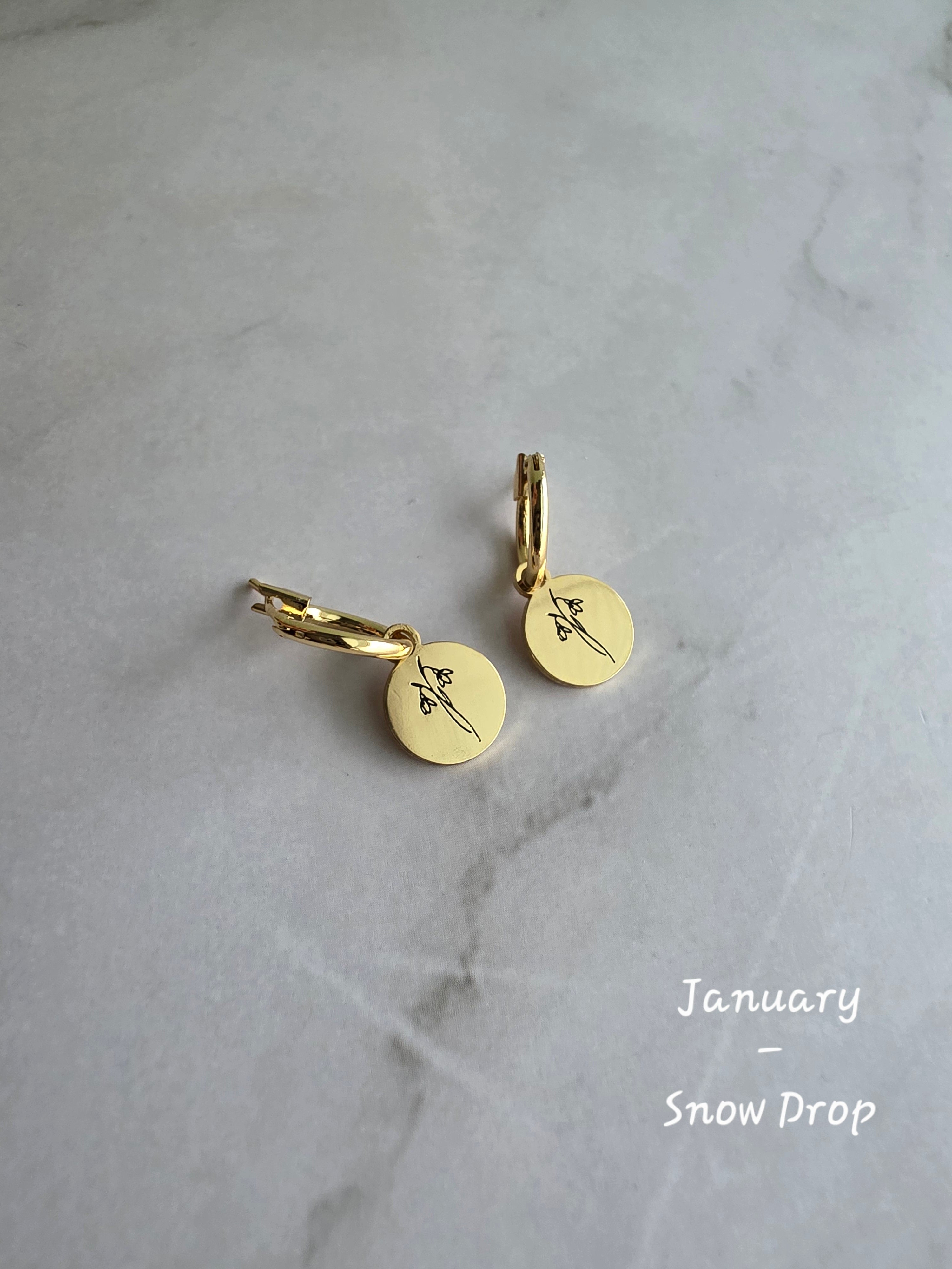 Elegant birth flower huggie earrings with engraved floral charms for women.