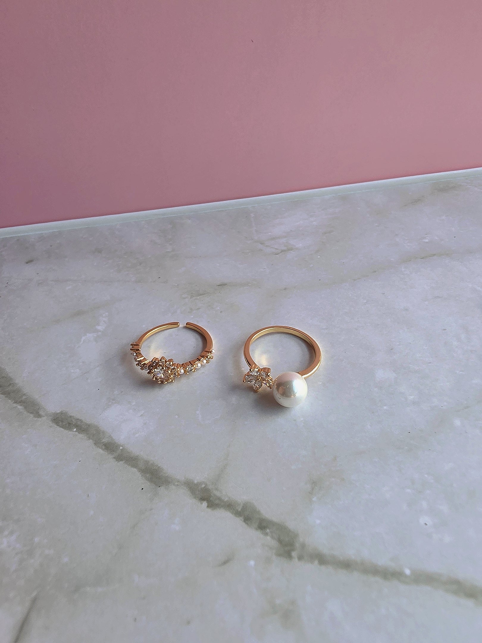 Women's adjustable toe rings with CZ stones, pearls, and flower motifs.