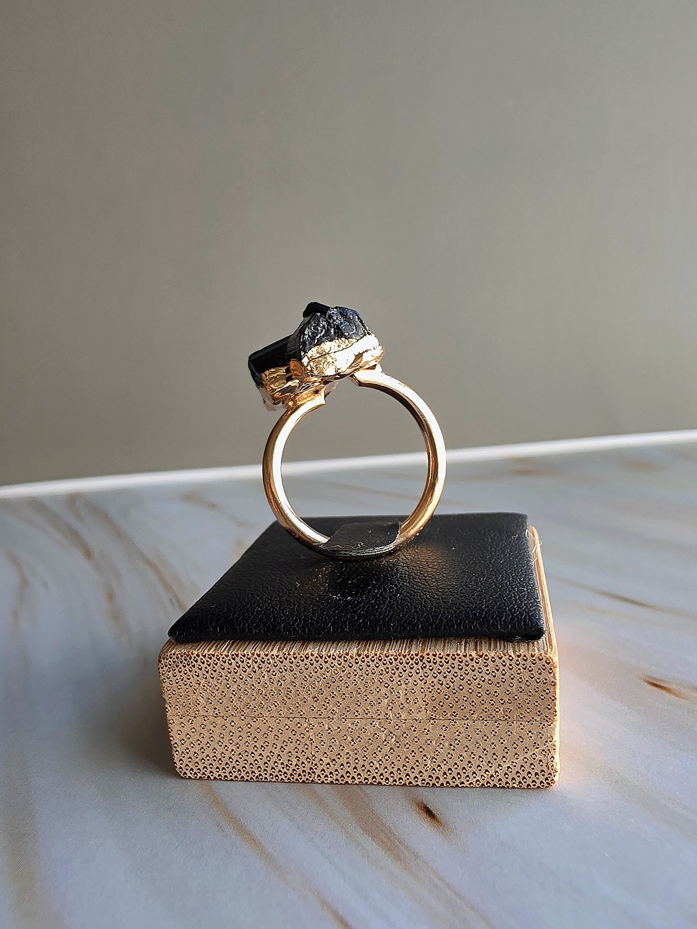 Natural black tourmaline crystal ring with an adjustable open band.