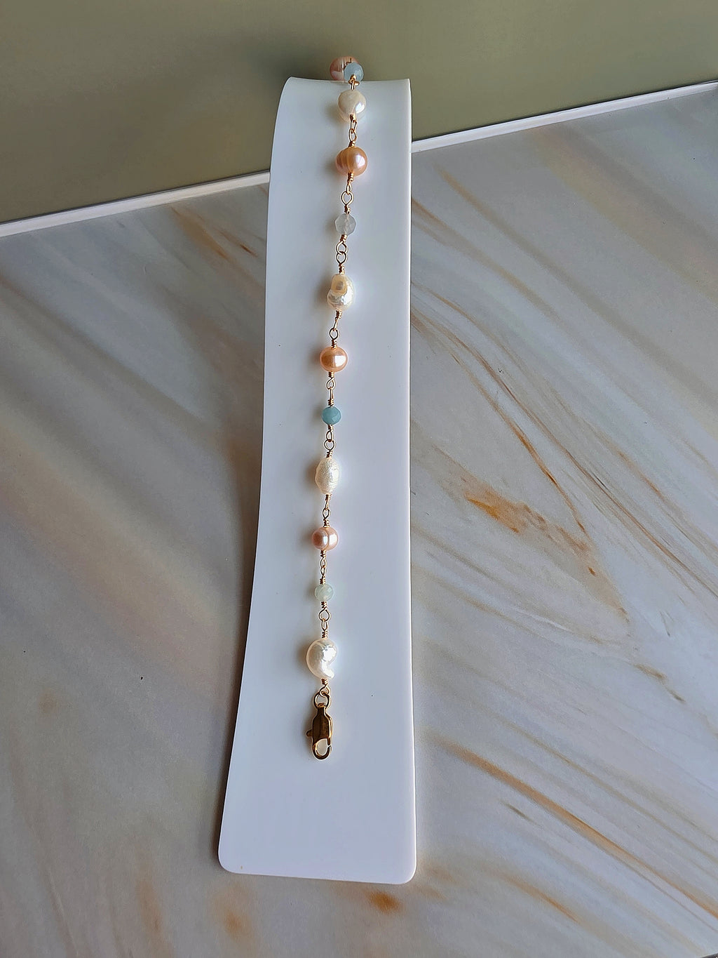 14K gold-plated beaded bracelet with genuine freshwater pearls and aquamarine.