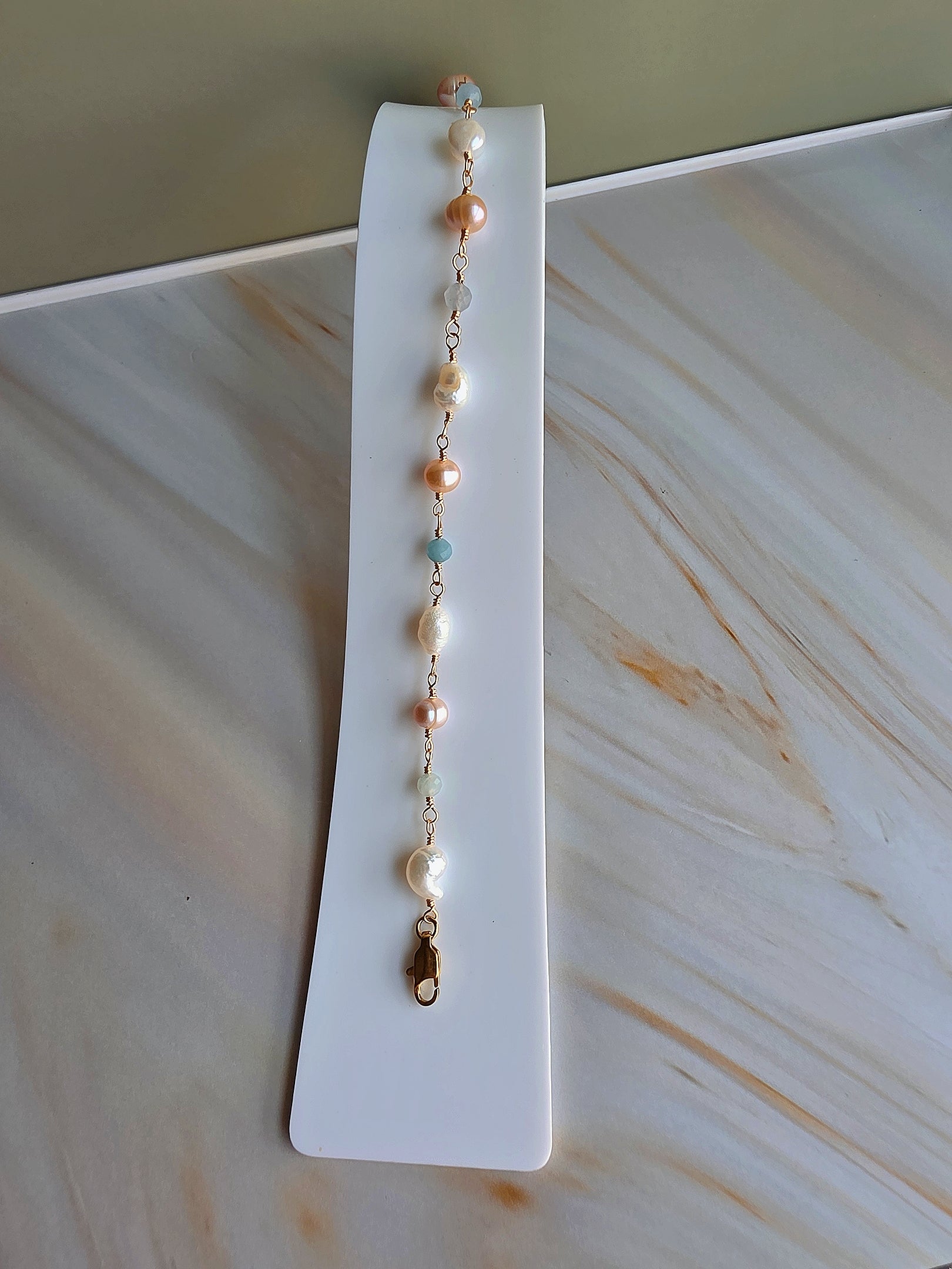 14K gold-plated beaded bracelet with genuine freshwater pearls and aquamarine.