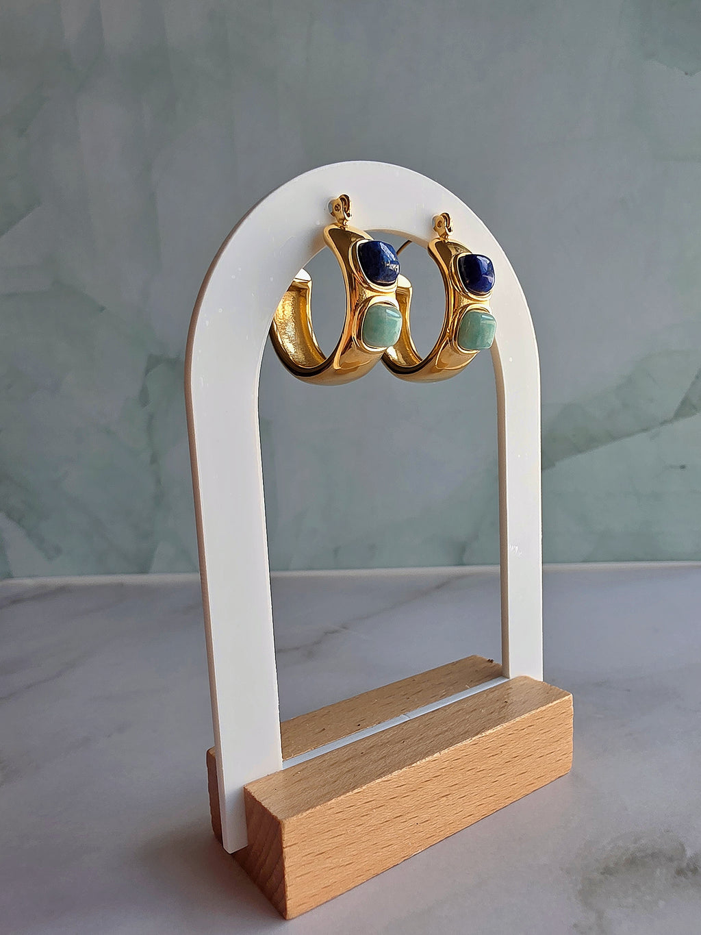 Women's statement hoop earrings with natural lapis lazuli and 14K gold plating.