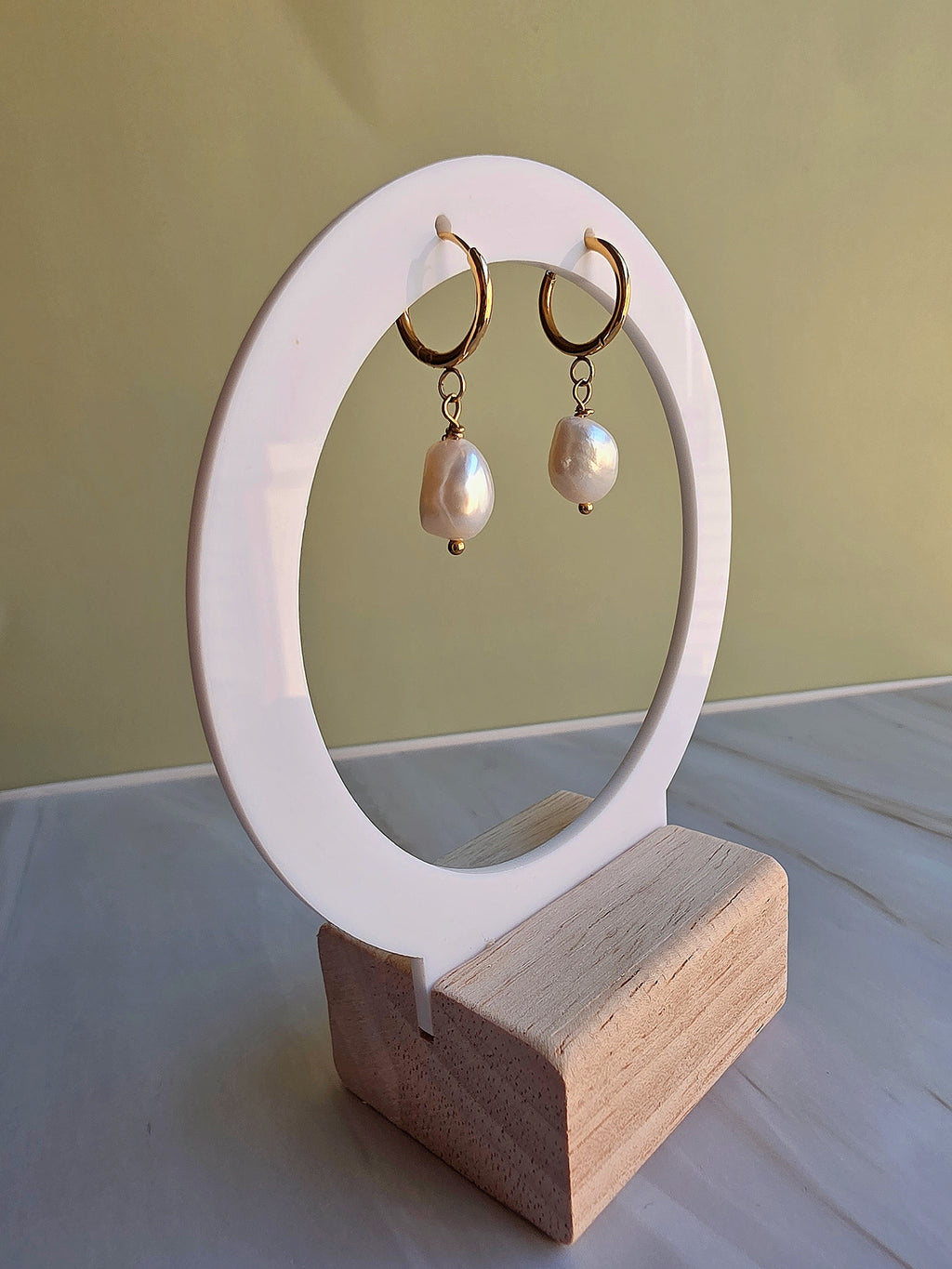 Elegant real pearl drop earrings featuring unique baroque freshwater pearls.