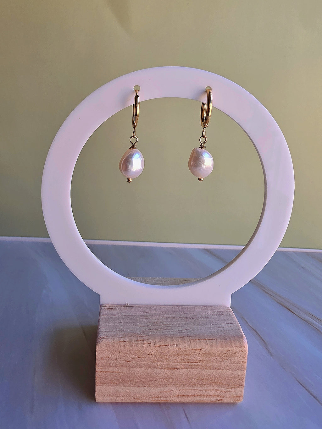Women's non-tarnish pearl hoop earrings with genuine baroque pearls.