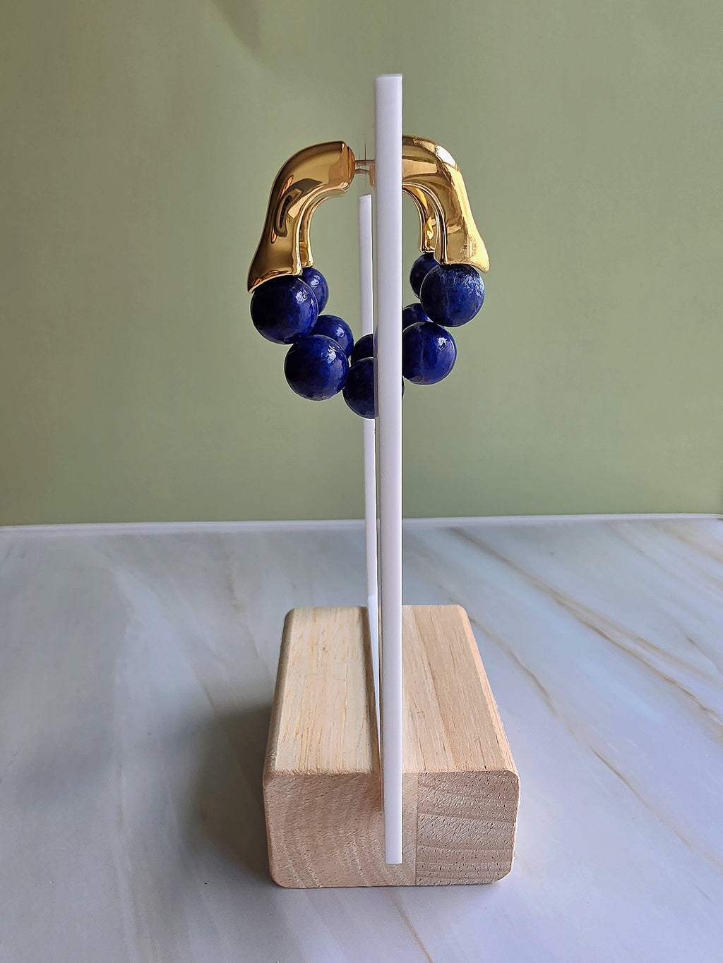 Vintage-style blue gemstone hoop earrings crafted with lapis lazuli.