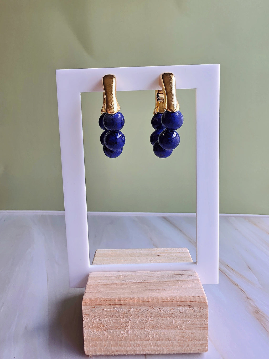 Lightweight lapis lazuli earrings with an elegant 18K gold-plated finish.