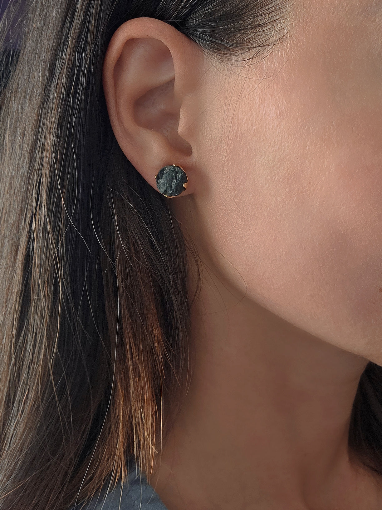 Raw black tourmaline crystal stud earrings in polished 18K gold-plated settings.