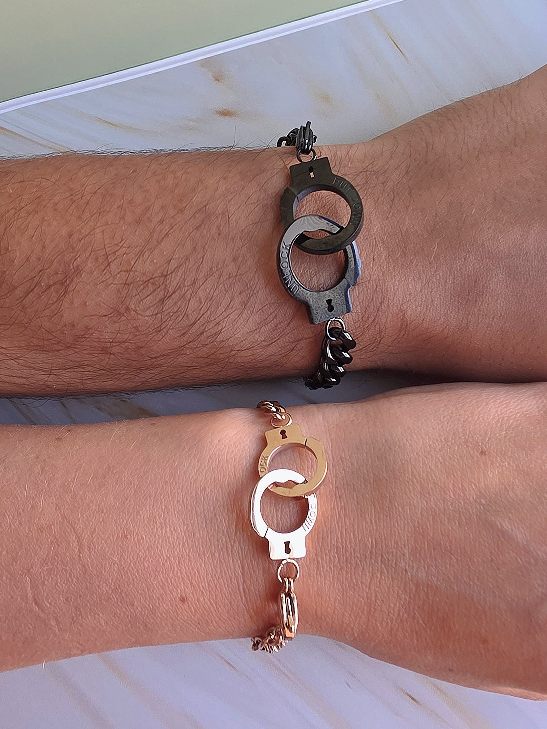 Durable non-tarnish handcuff bracelets for couples suitable for everyday wear.