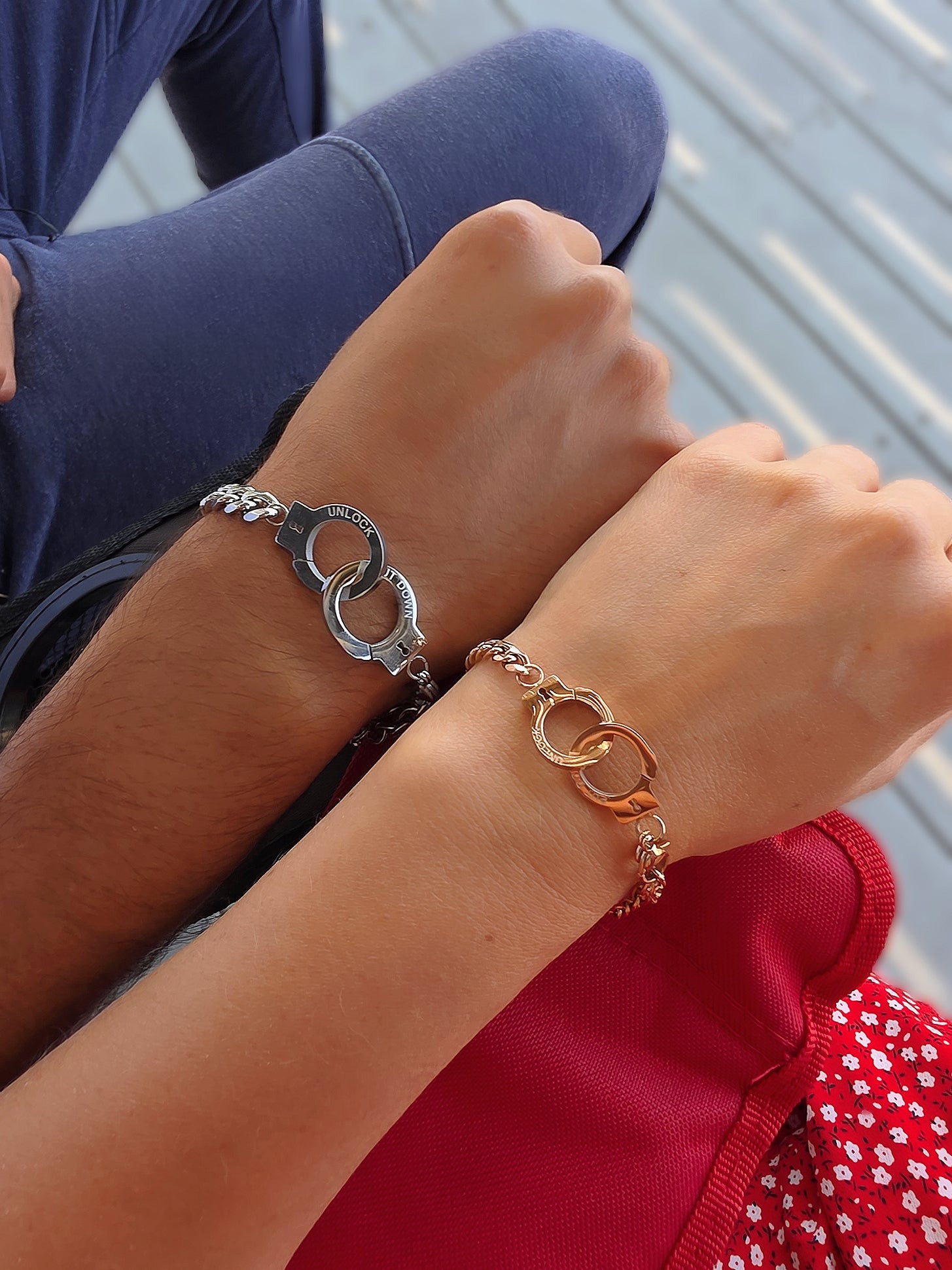 Minimalist stainless steel couple bracelets with adjustable sizing.