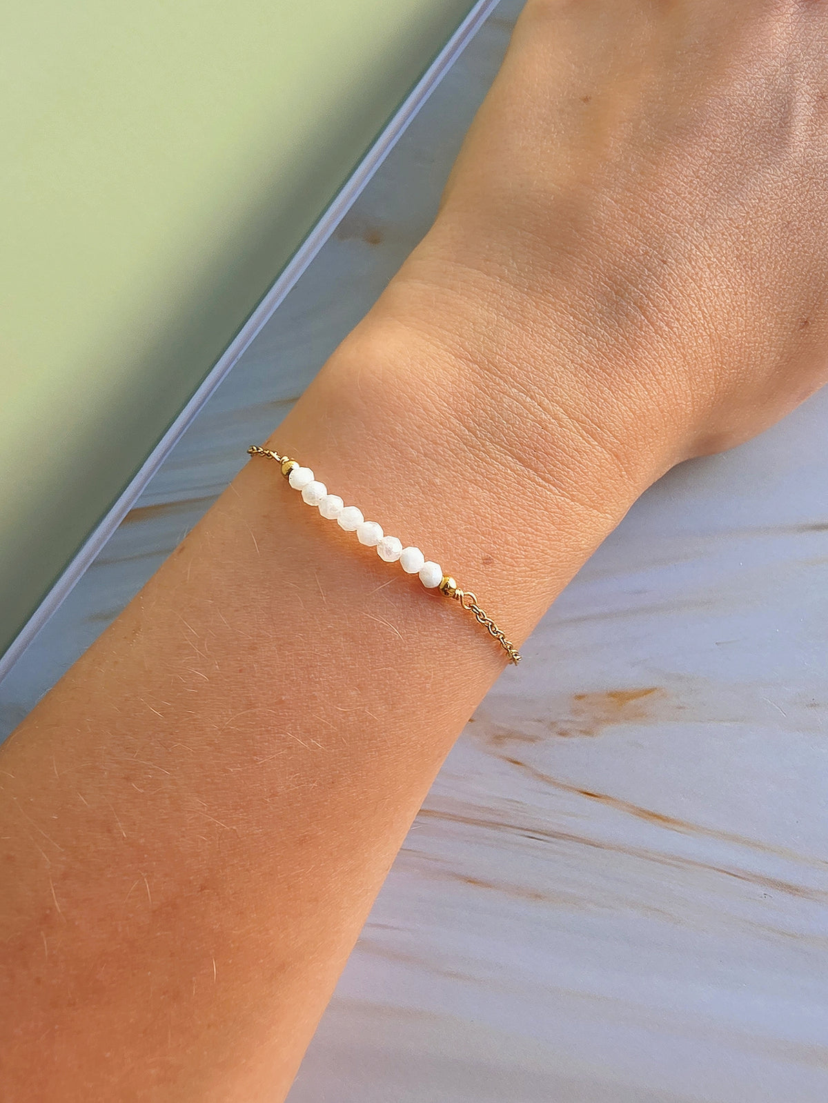 Natural gemstone bracelet available in Aquamarine, Emerald, and Moonstone.
