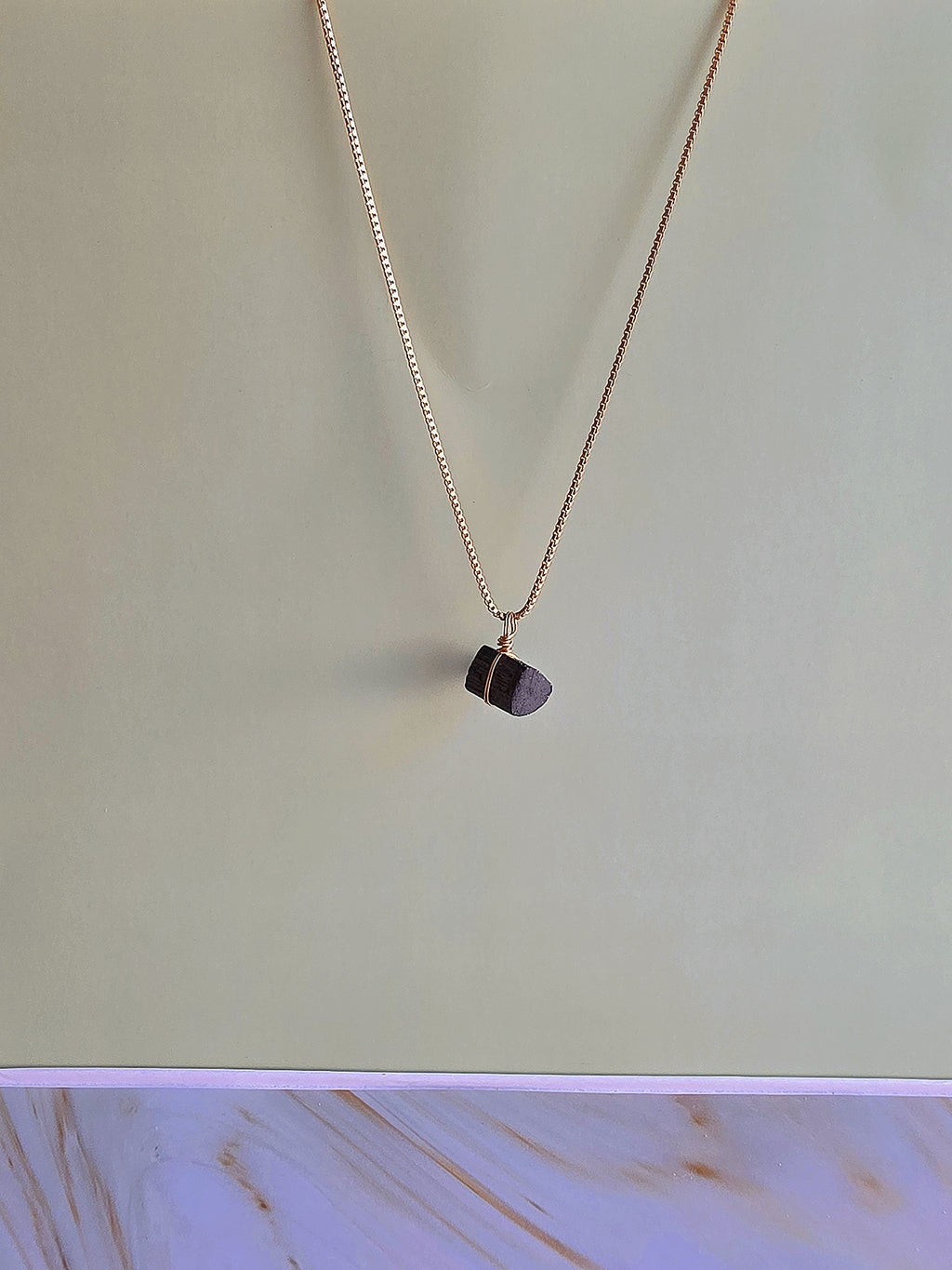 Minimalist black tourmaline pendant necklace, a thoughtful gift for women.