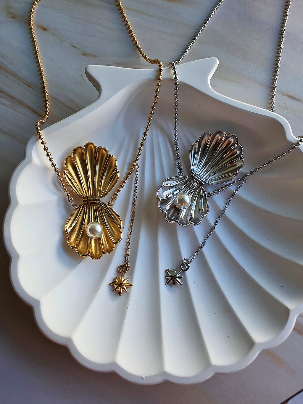 Coastal seashell necklace crafted from stainless steel with 18K gold plating.