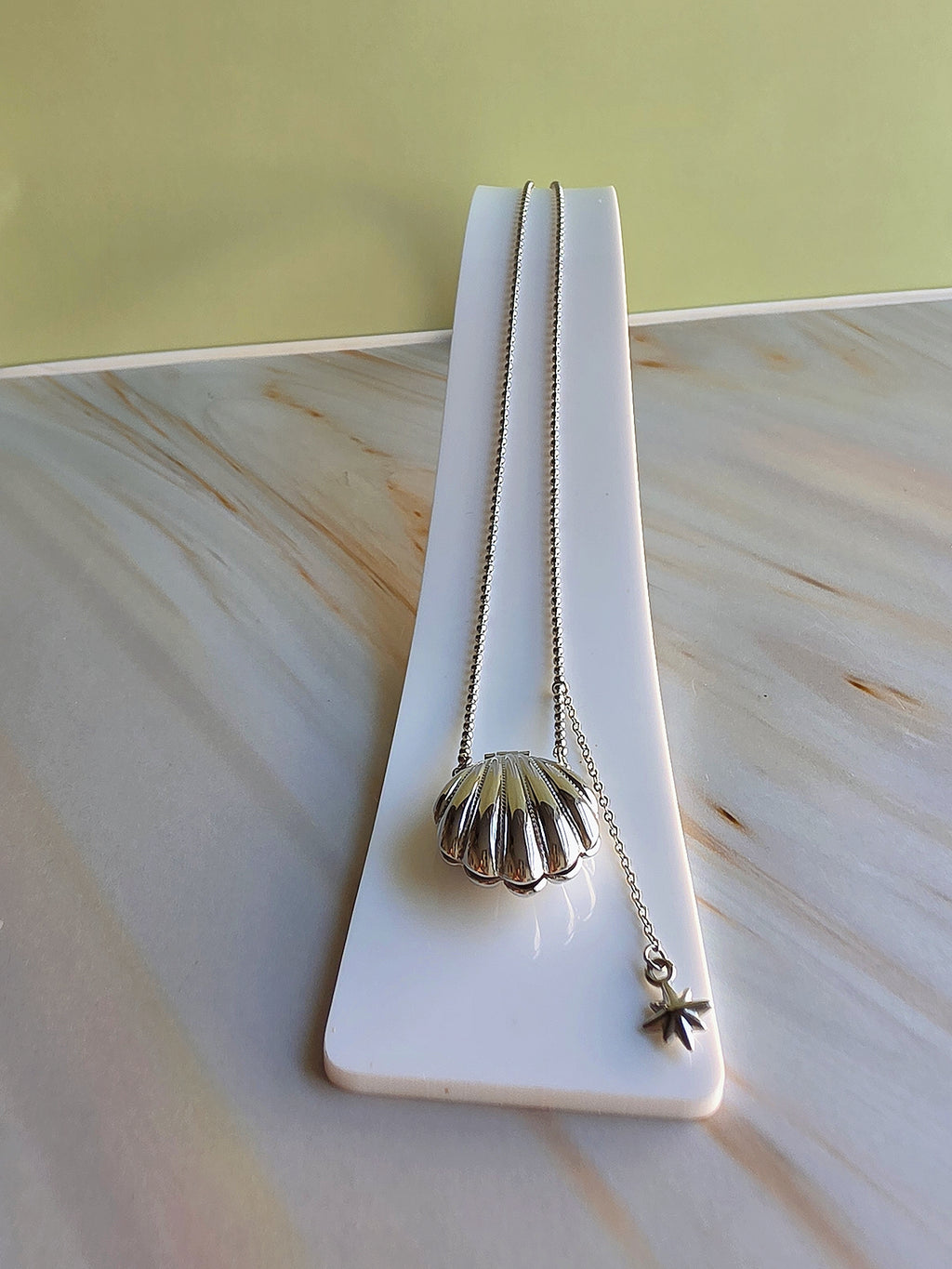 Delicate beach-themed seashell and pearl necklace for women.