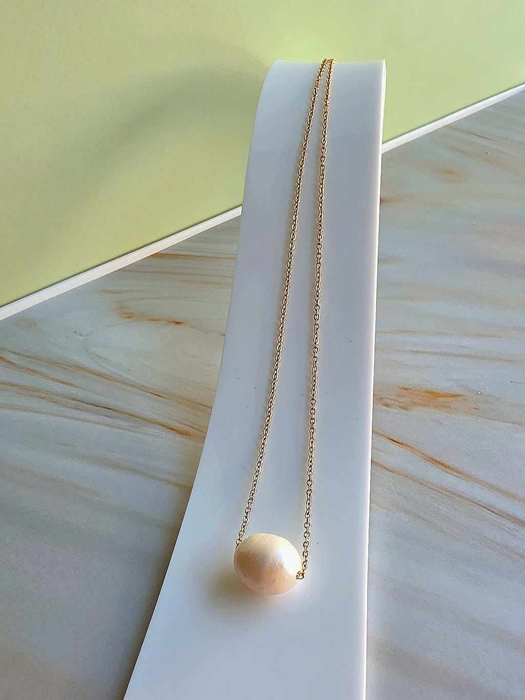 Classic freshwater pearl necklace with a waterproof non-tarnish gold finish.