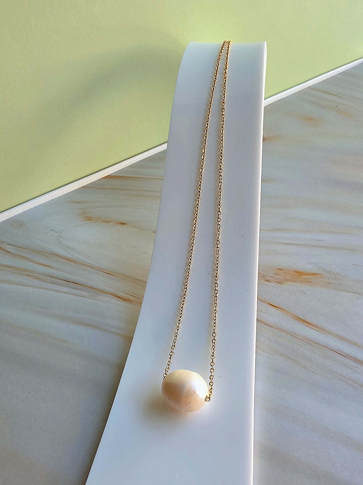 Classic freshwater pearl necklace with a waterproof non-tarnish gold finish.