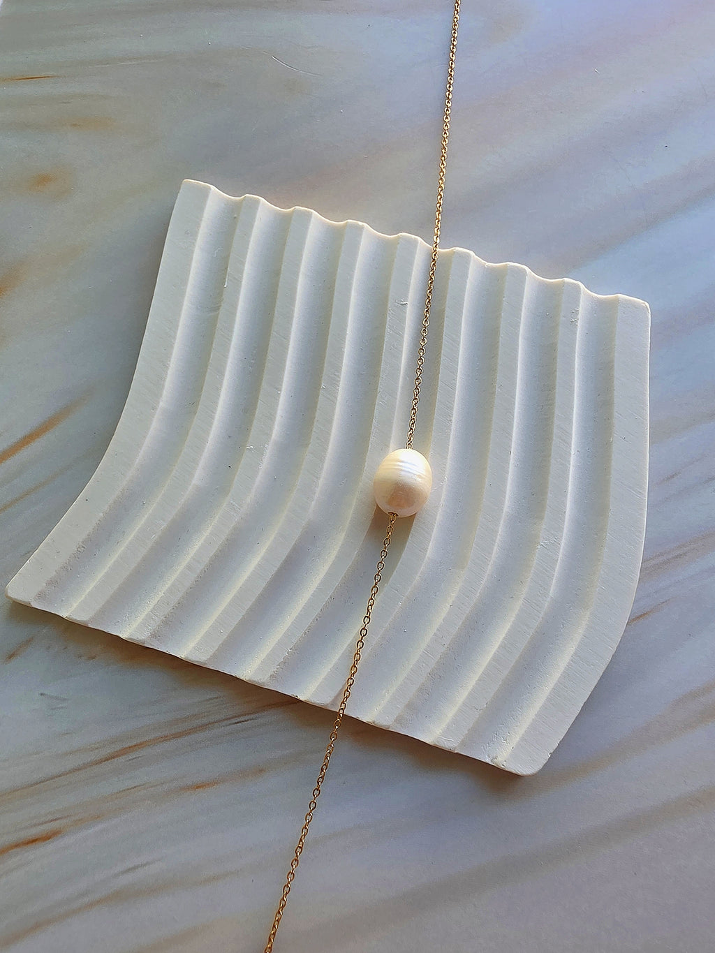 Dainty 18K gold-plated pearl necklace perfect for layering and daily style.