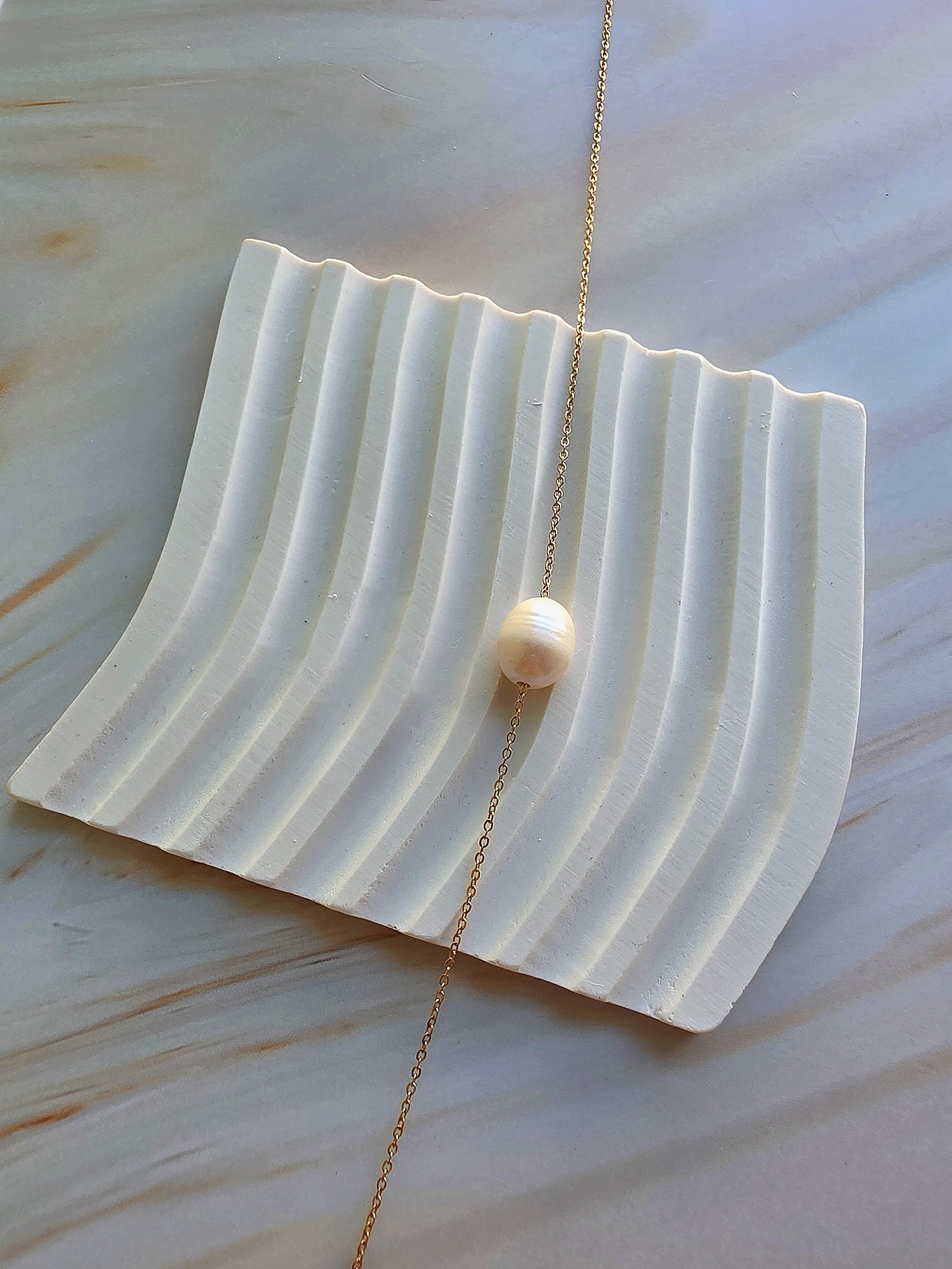 Dainty 18K gold-plated pearl necklace perfect for layering and daily style.