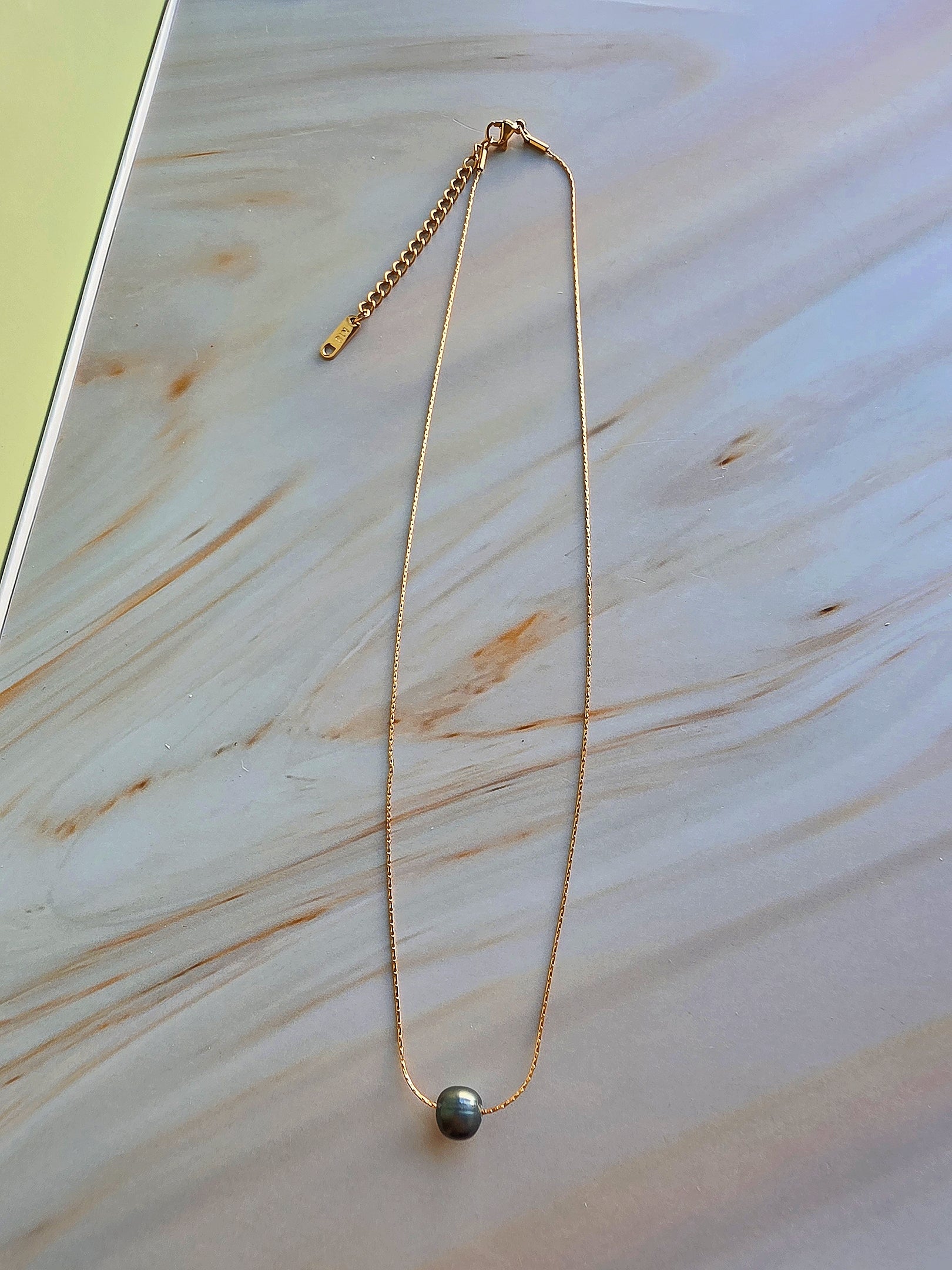 Classic freshwater pearl choker necklace with a timeless minimalist design.