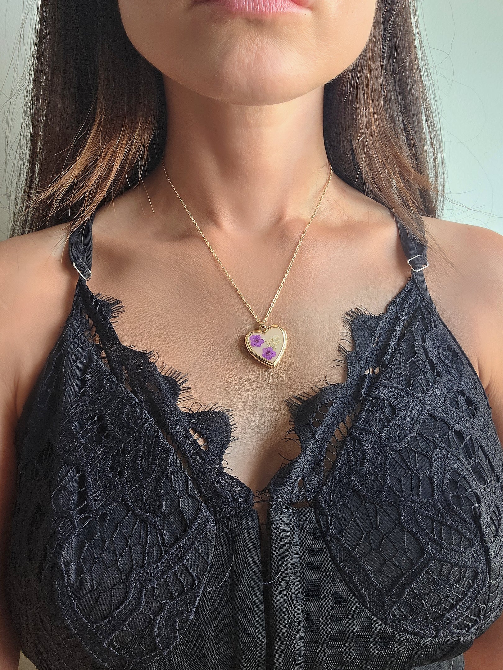 Pressed flower heart locket necklace handcrafted with real preserved flowers.