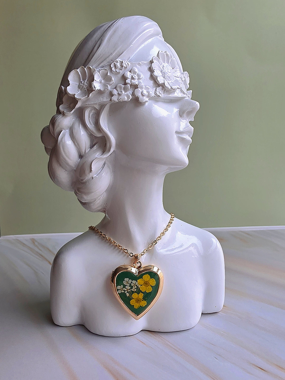 Silver heart locket necklace with real pressed flower design.