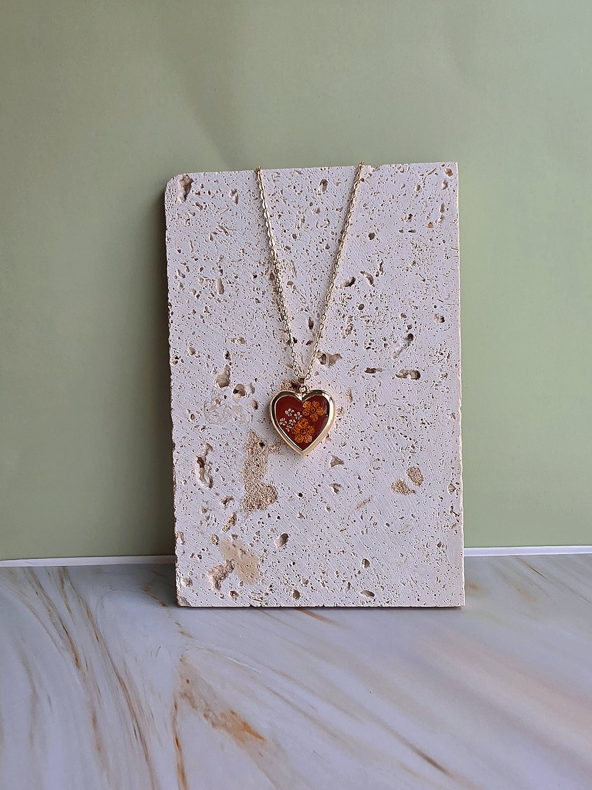 Elegant botanical heart locket necklace for women.