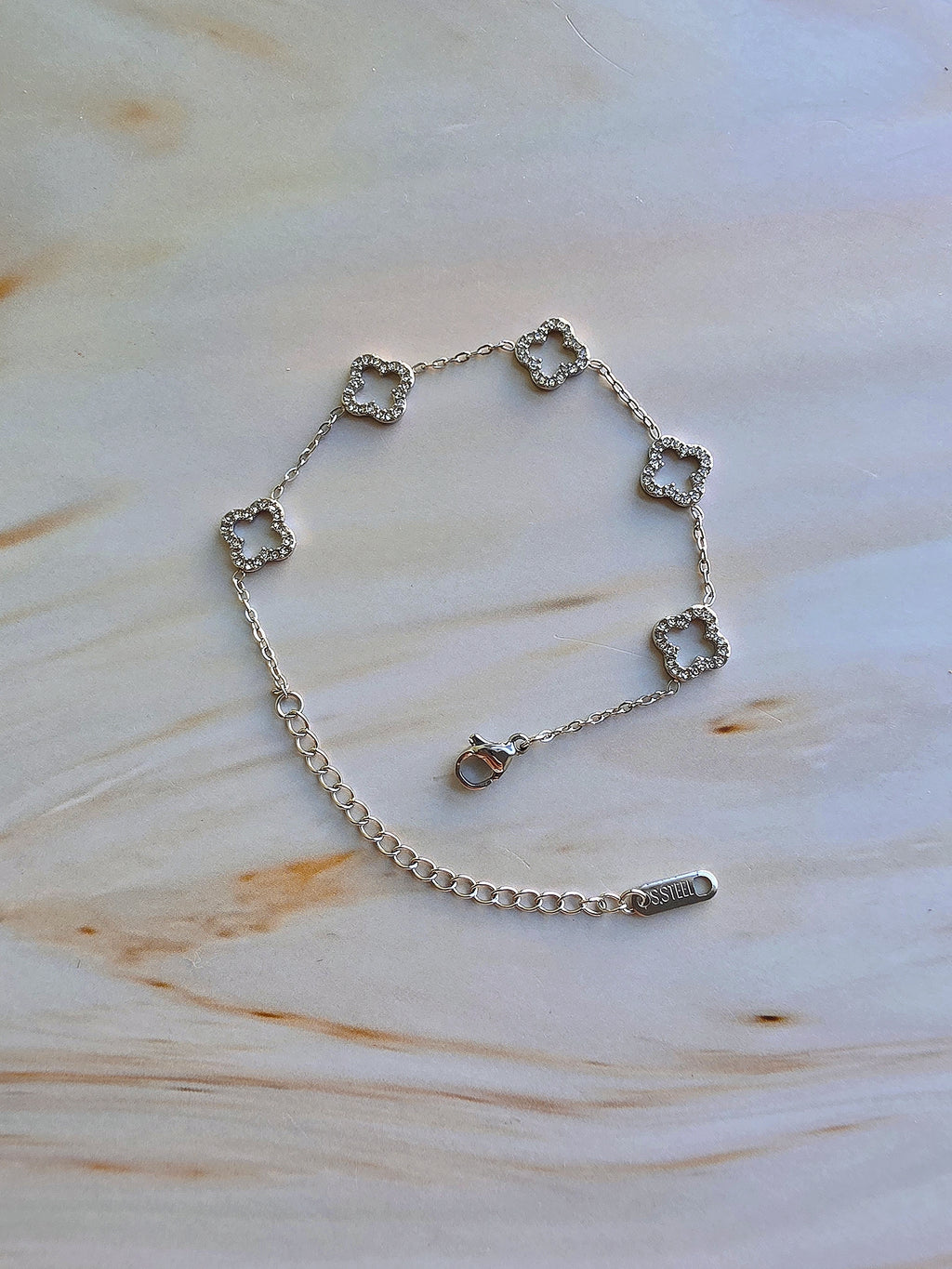 Dainty 4 leaf clover bracelet for women in gold or silver.