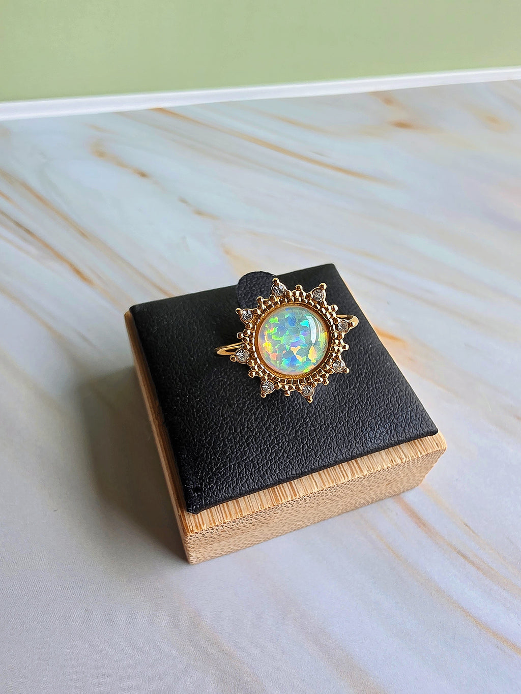 Gold-plated adjustable opal rings with shimmering heart and floral motifs.