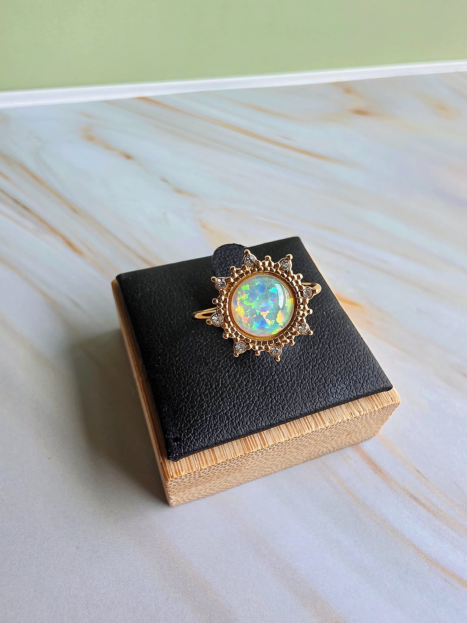 Gold-plated adjustable opal rings with shimmering heart and floral motifs.
