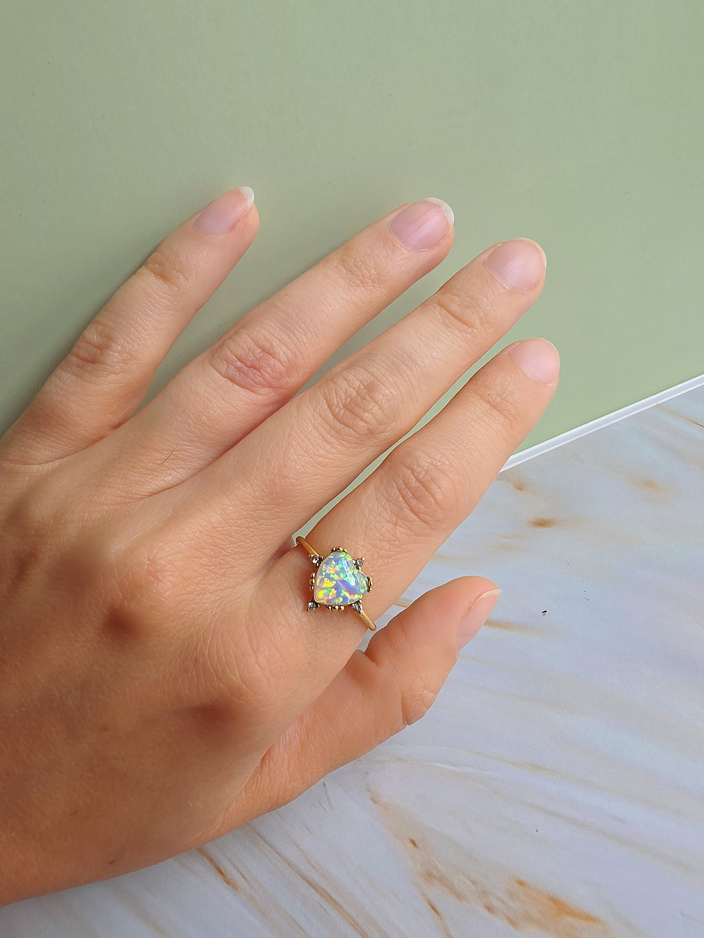 Elegant adjustable opal rings with sunflower and heart designs for everyday wear.