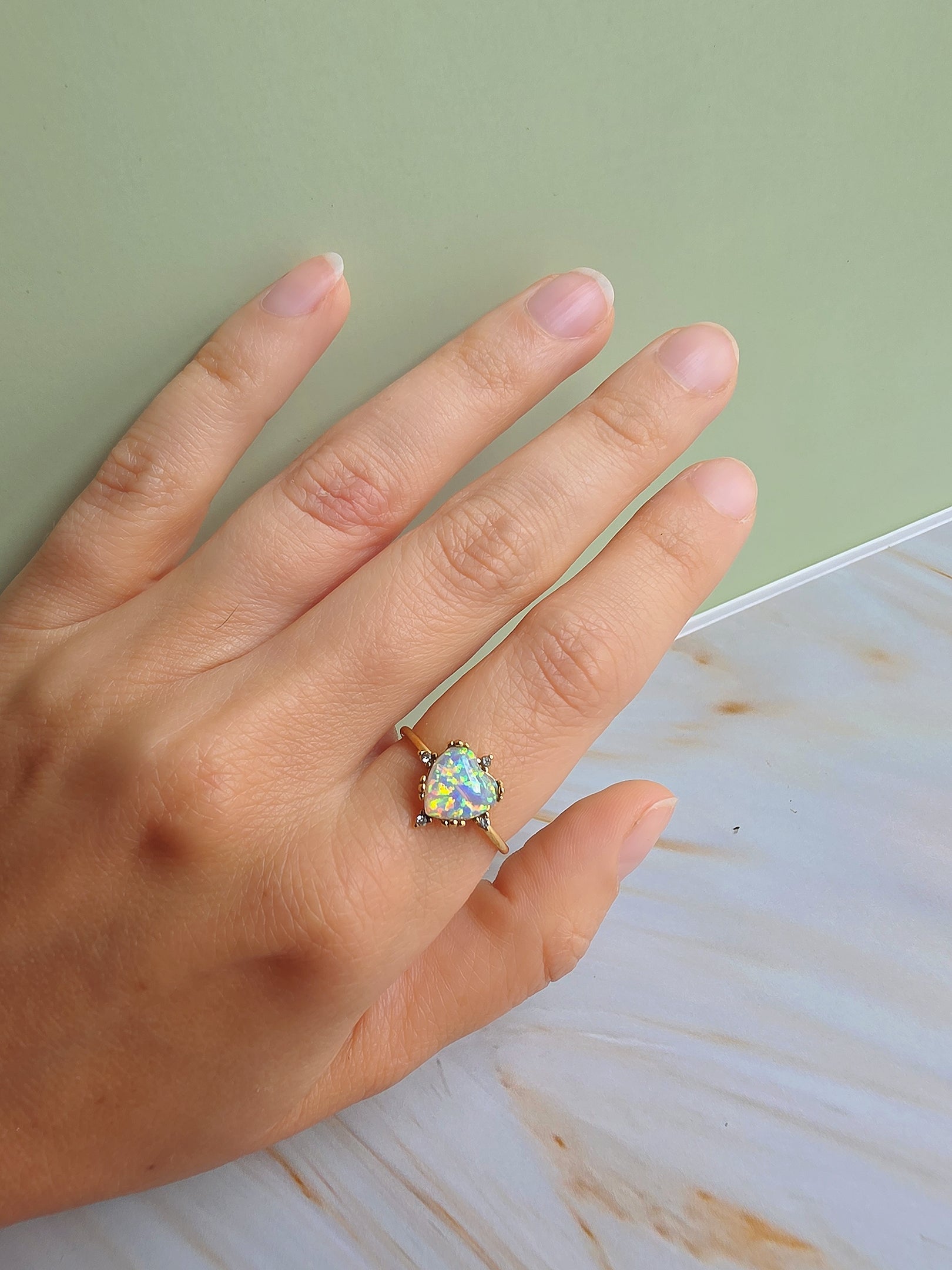 Elegant adjustable opal rings with sunflower and heart designs for everyday wear.