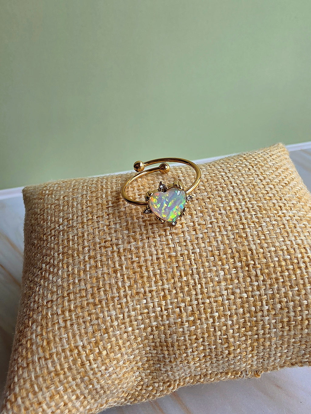 October birthstone opal rings in sunflower and heart styles with adjustable bands.
