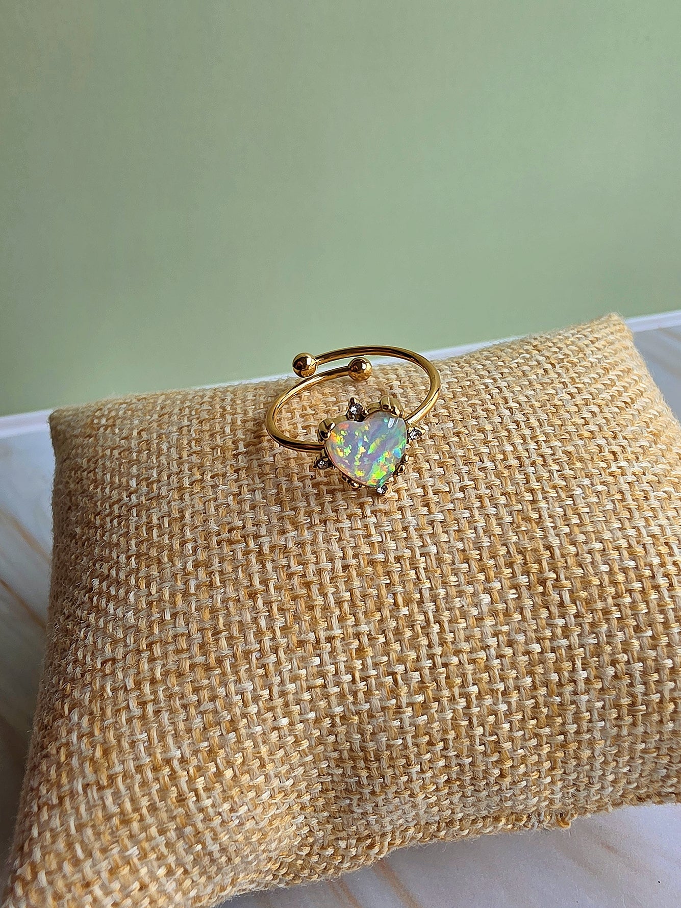 October birthstone opal rings in sunflower and heart styles with adjustable bands.
