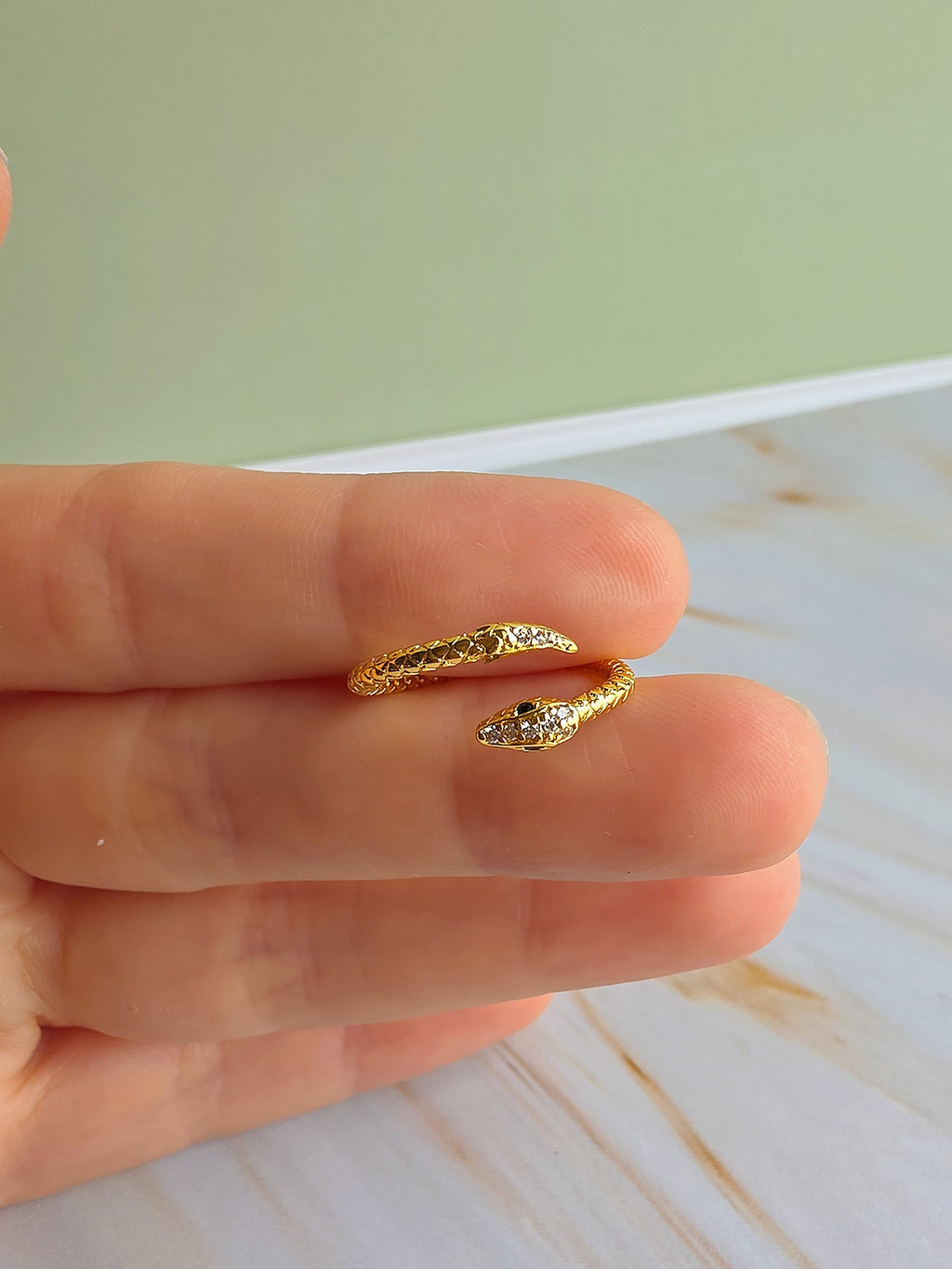 18K gold-plated snake ring featuring an adjustable open wrap band.