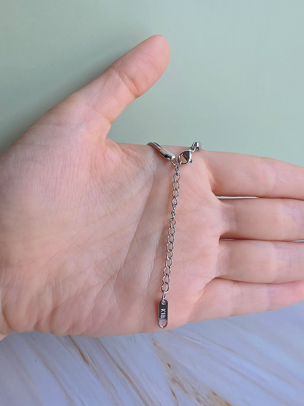 Adjustable his and hers bracelets with matching love knot details, perfect for everyday wear and meaningful gifts.