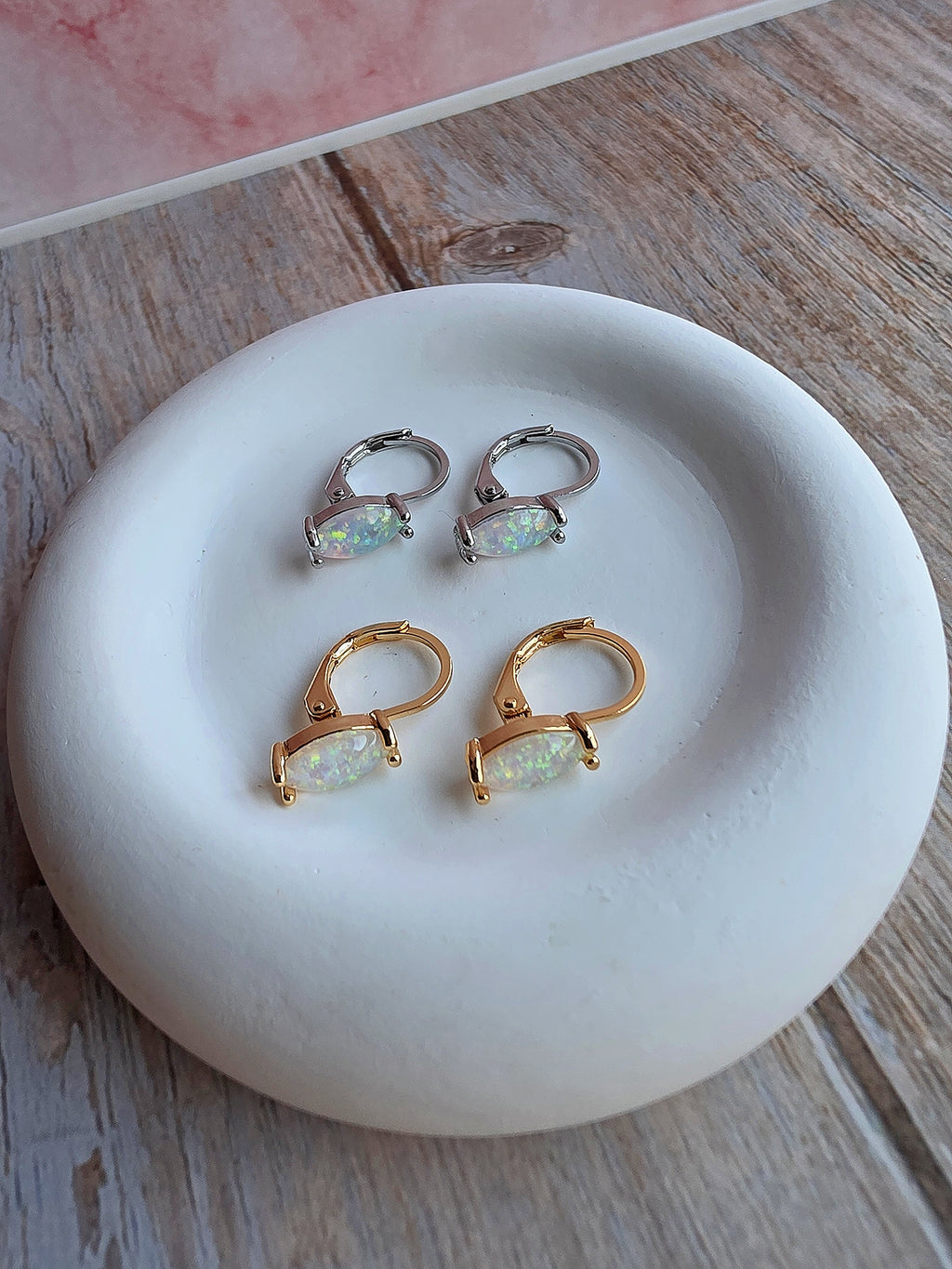 14K gold-plated huggie earrings featuring marquise-shaped opal gemstones.
