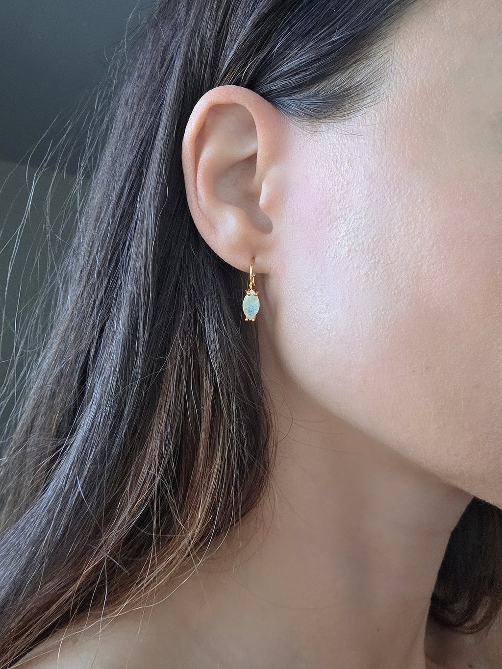 Silver-plated marquise opal huggie hoop earrings featuring October birthstone opals.