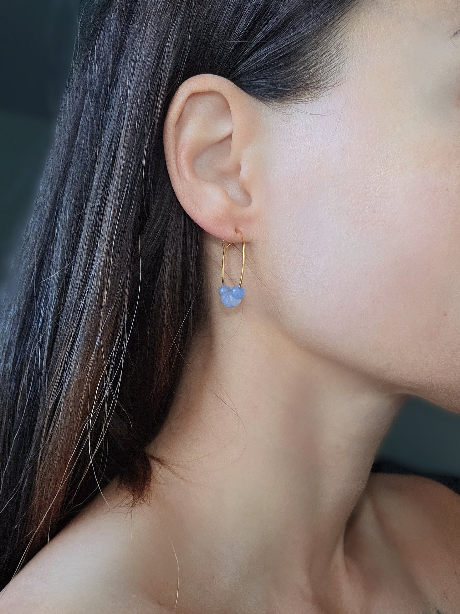 Elegant aquamarine gemstone hoop earrings with an 18K gold-plated finish.