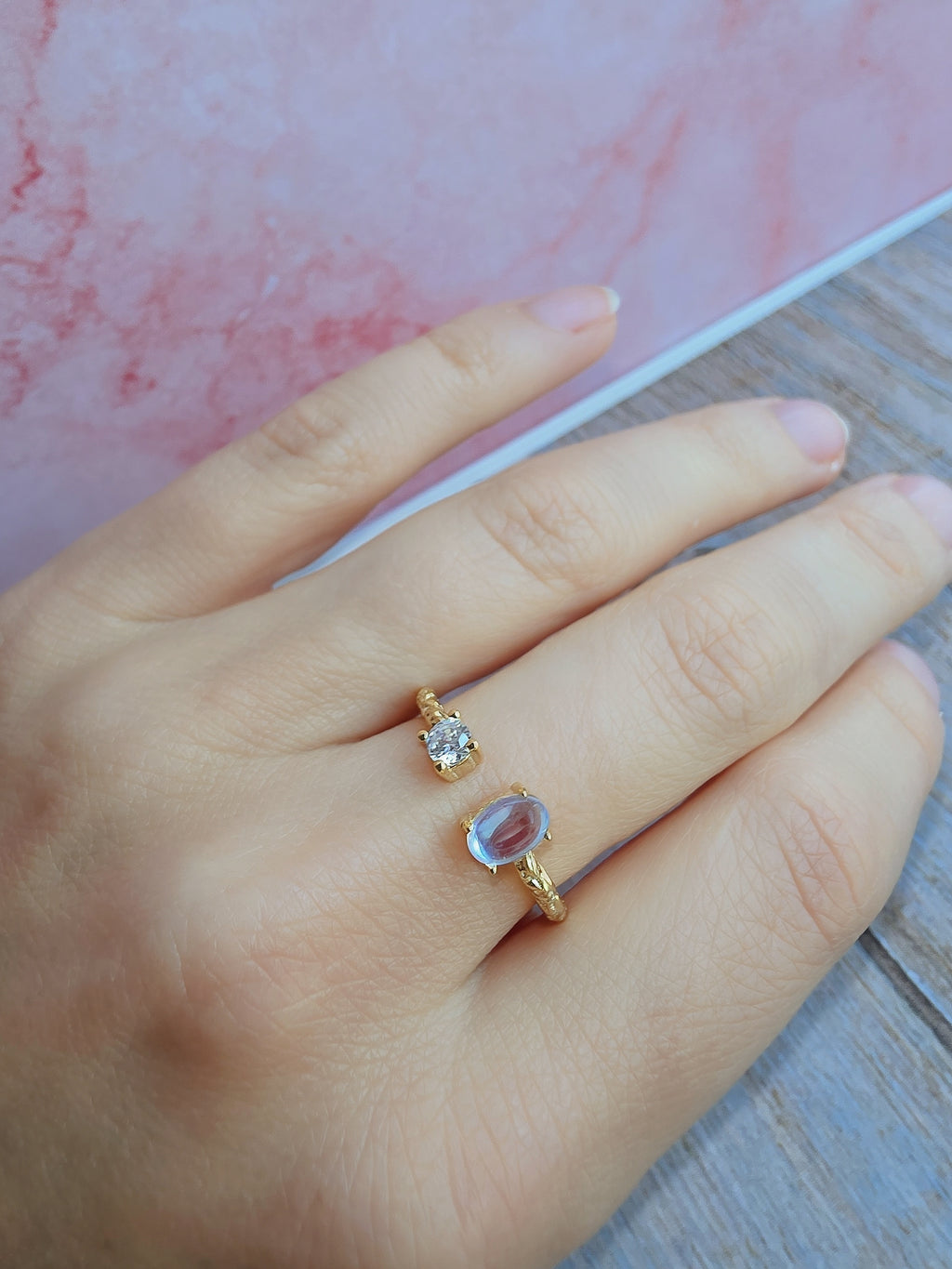 Women's rainbow moonstone ring with an 18K gold-plated hammered finish.
