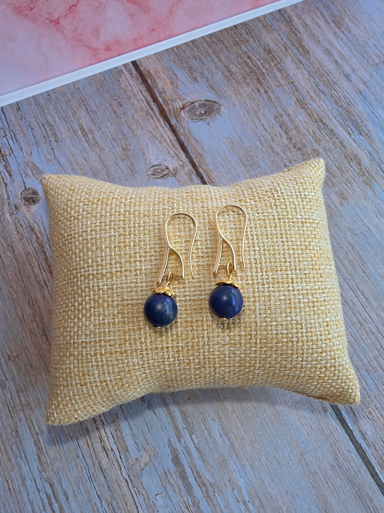 Women's 14K gold-plated gemstone earrings featuring black, blue, and red natural stones.