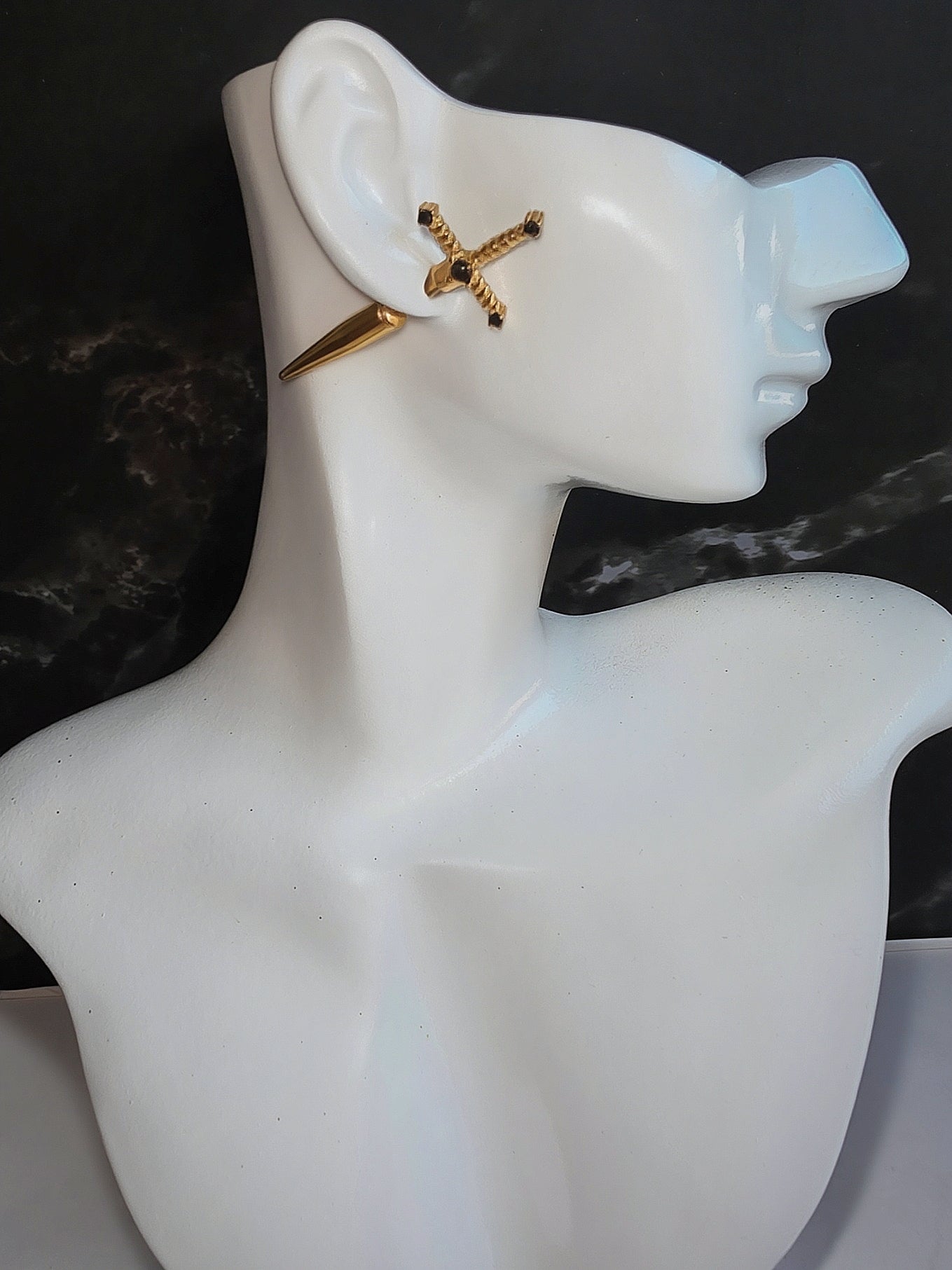 Minimalist dagger stud earrings with a sleek gold-plated finish.