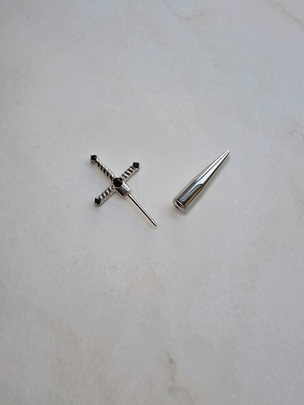 Lightweight sword stud earrings with a modern minimalist design.