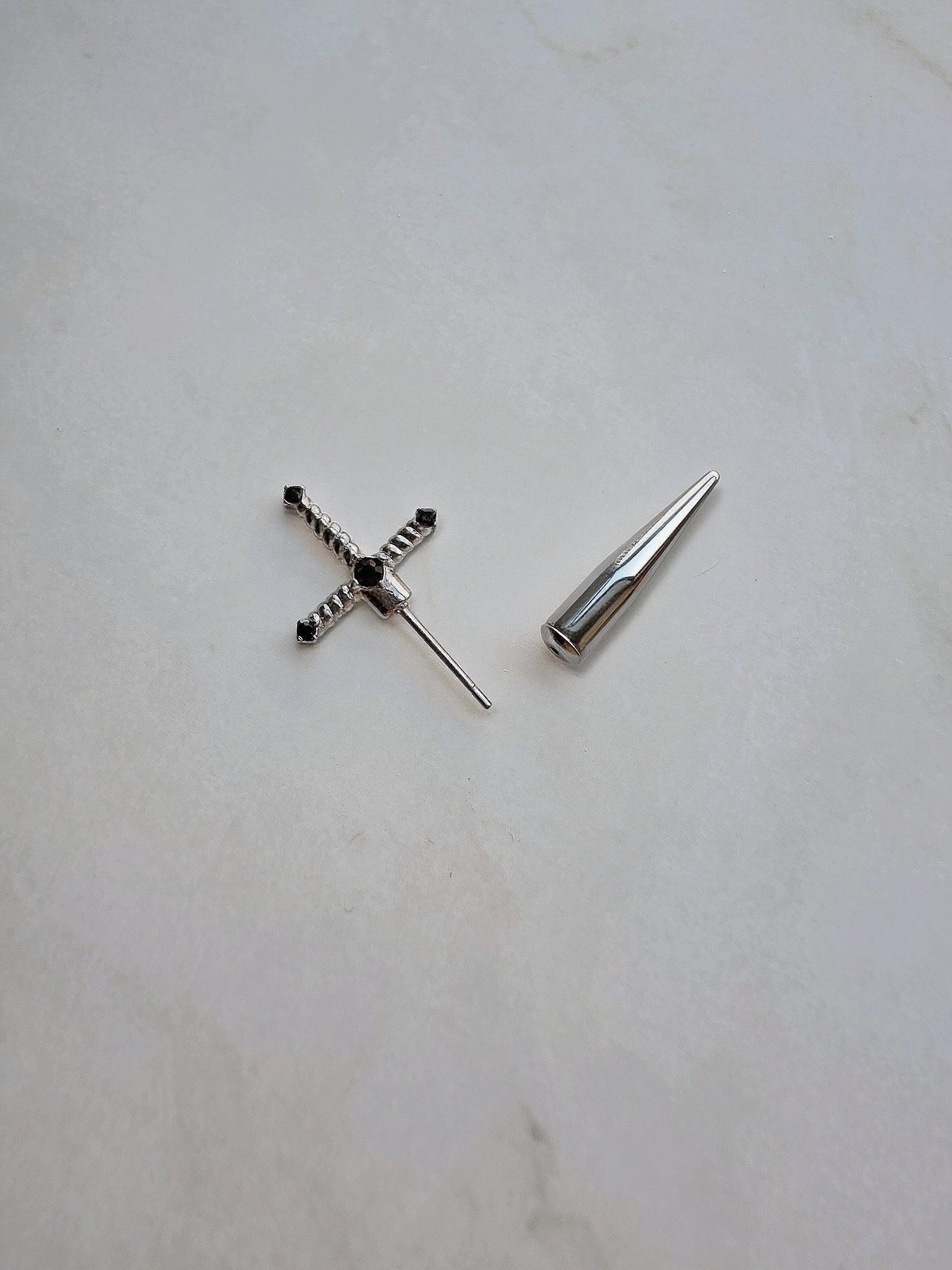 Lightweight sword stud earrings with a modern minimalist design.